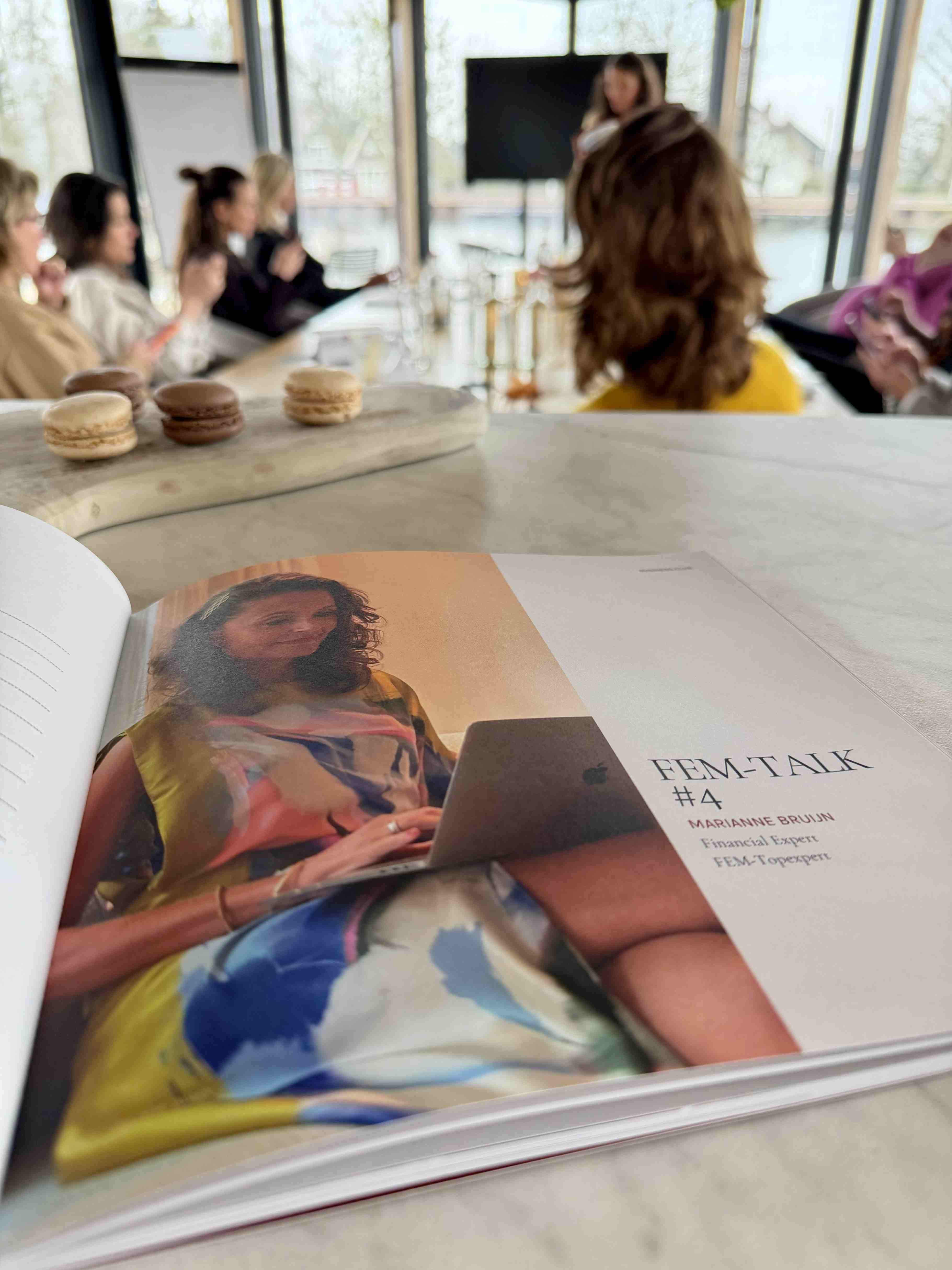 FEM-Talk magazine with macarons in the background